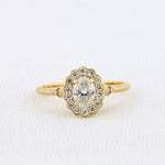 Load image into Gallery viewer, Poppy Halo Ring with Oval Diamond in Yellow Gold
