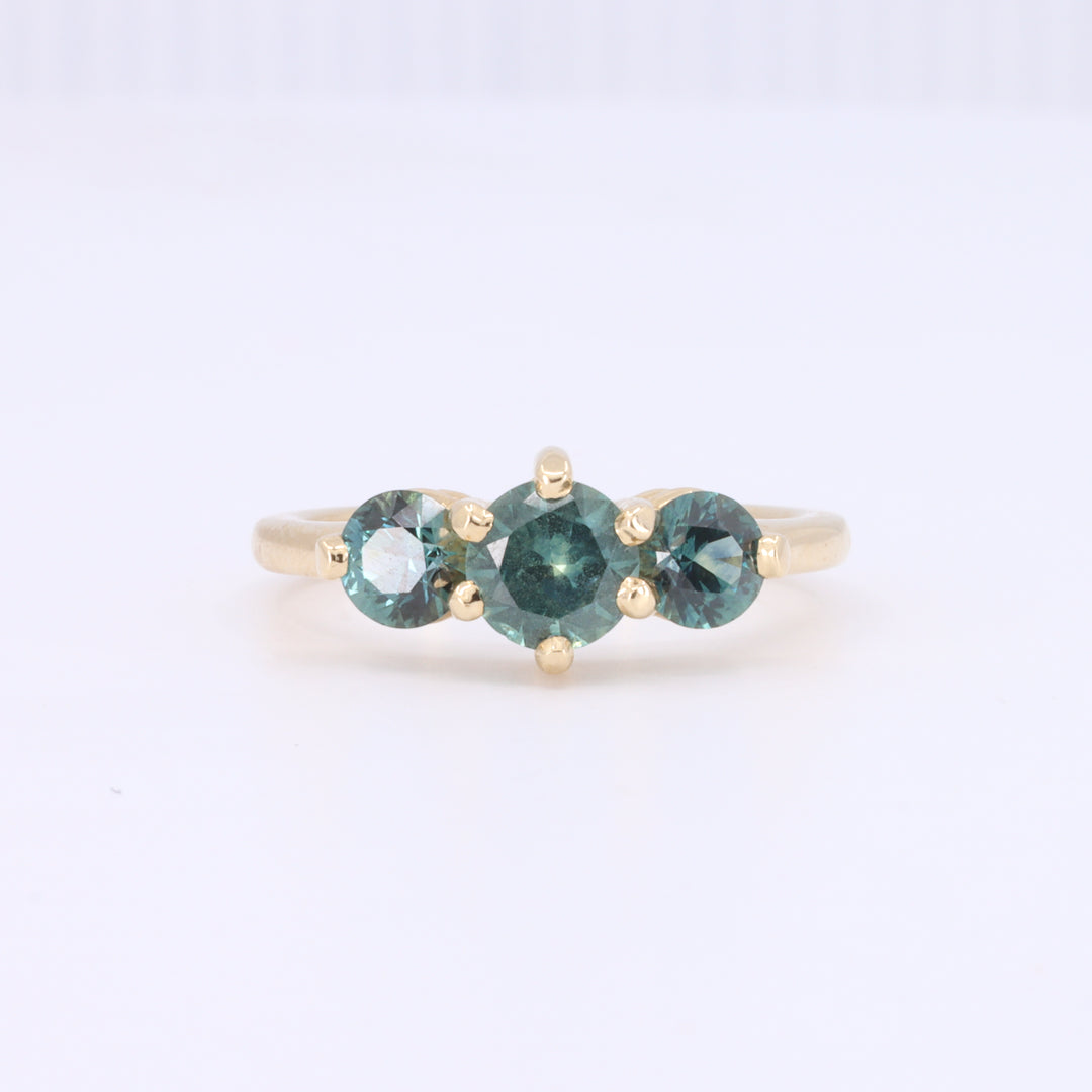 Three Stone Montana Sapphire Ring in Yellow Gold