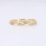 Load image into Gallery viewer, Gold twisted band ring adorned with sparkling cubic zirconia stones for a stylish and elegant look.
