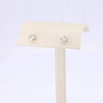 Load image into Gallery viewer, Gold stud earrings with clear cubic zirconia stones, perfect for elegant and timeless style.