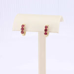 Load image into Gallery viewer, Ruby Huggie Earrings, 1.20cttw in 14K Yellow Gold - Kizer Cummings Jewelers