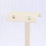 Load image into Gallery viewer, Gold stud earrings with iridescent opal stones, perfect for adding a touch of elegance to any outfit.