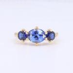 Load image into Gallery viewer, Three Stone Sapphire Ring with East West Set Oval Center set in Yellow Gold
