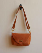 Load image into Gallery viewer, Tan Leather Crossbody Bag with Adjustable Strap and Brass Hardware - Kizer Cummings Jewelers