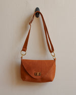 Load image into Gallery viewer, Tan Leather Crossbody Bag with Adjustable Strap and Brass Hardware