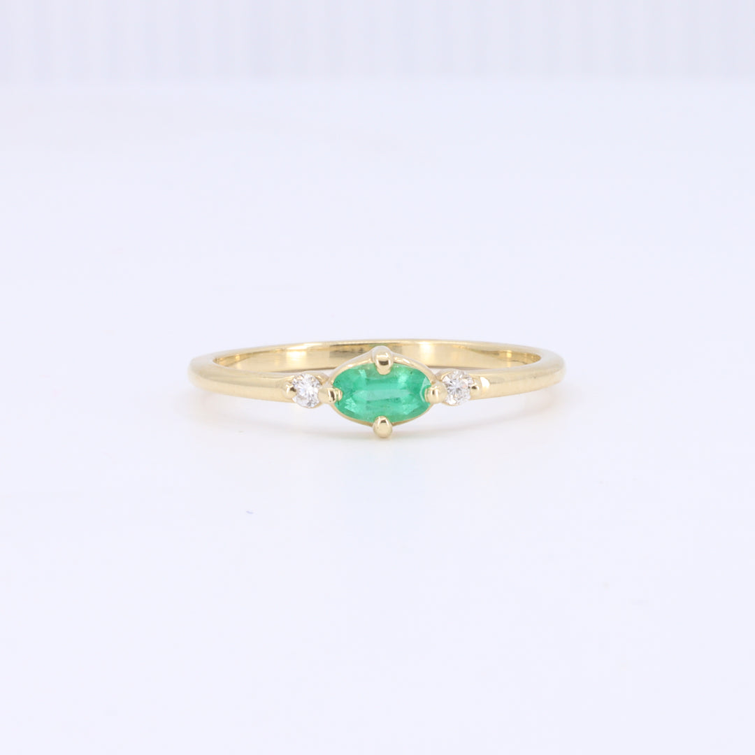 East-West Oval Emerald Ring with Diamond Trim in Yellow Gold