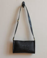 Load image into Gallery viewer, Black Alligator Vinyl Crossbody Bag with Adjustable Strap and Yellow Metal Hardware - Kizer Cummings Jewelers