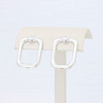 Load image into Gallery viewer, Open Square Knot Drop Earrings in Sterling Silver with 14K White Gold Posts - Kizer Cummings Jewelers