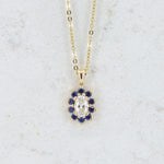 Load image into Gallery viewer, Diamond and Sapphire Halo Pendant, 0.37ct Oval Diamond and 0.28cttw Sapphires in 14K Yellow Gold, 18 inch Chain