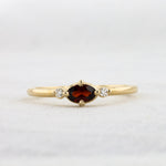 Load image into Gallery viewer, East-West Oval Garnet Ring with Diamond Trim in Yellow Gold
