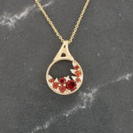 Load image into Gallery viewer, Garnet and Diamond Cluster Circle Pendant, 0.50cttw Garnet with 0.04cttw Diamond in 14K Yellow Gold, 18 inch Chain - Kizer Cummings Jewelers