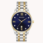 Load image into Gallery viewer, Bulova men's watch with navy dial, gold and silver stainless steel band, crystal accents, and Roman numerals.