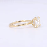 Load image into Gallery viewer, Elegant gold engagement ring featuring a sparkling round diamond and subtle side stones for added brilliance.