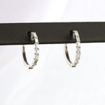 Load image into Gallery viewer, Baguette Diamond Huggie Earrings in White Gold

