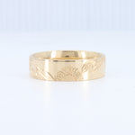 Load image into Gallery viewer, Gold engraved sunflower band ring with intricate floral details, perfect for unique, stylish jewelry lovers.