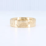 Load image into Gallery viewer, Gold engraved sunflower band ring with intricate floral details, perfect for unique, stylish jewelry lovers.