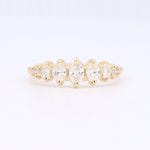 Load image into Gallery viewer, Gold five-stone ring with brilliant marquise and round diamonds, perfect for elegant occasions.