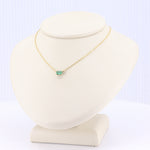 Load image into Gallery viewer, Gold chain necklace with an emerald green rectangular pendant, elegant and minimalist style, perfect for any occasion.