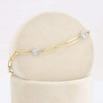 Load image into Gallery viewer, Gold and silver link bracelet with sparkling oval charms, elegant jewelry piece for any occasion.