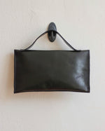 Load image into Gallery viewer, Glossy Black Leather Asymmetrical Clutch Bag with White Metal Hardware - Kizer Cummings Jewelers
