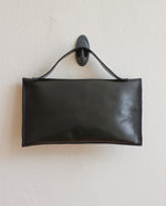 Load image into Gallery viewer, Glossy Black Leather Asymmetrical Clutch Bag with White Metal Hardware