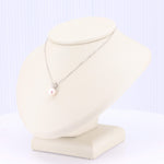 Load image into Gallery viewer, Sterling silver necklace featuring a single pink freshwater pearl, elegantly displayed on a cream-colored bust.