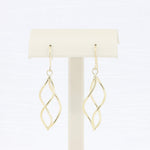 Load image into Gallery viewer, Gold swirl dangle earrings in a sleek design, perfect for modern elegance and everyday wear.