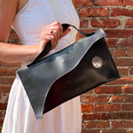 Load image into Gallery viewer, Glossy Black Leather Asymmetrical Clutch Bag with White Metal Hardware