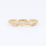 Load image into Gallery viewer, Delicate gold twist ring featuring small sparkling diamonds, perfect for everyday elegance.