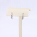 Load image into Gallery viewer, Channel Set Diamond Oval Huggie Earrings in White Gold