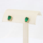 Load image into Gallery viewer, Emerald Cut Emerald Beaded Halo Stud Earrings, 1.08cttw in 14K Yellow Gold