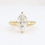 Load image into Gallery viewer, Elegant two-stone diamond ring in a gold band, featuring pear-cut stones for a timeless, sophisticated look.