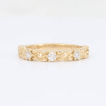 Load image into Gallery viewer, Delicate gold band ring featuring three sparkling round diamonds and intricate leaf designs. Perfect for elegant occasions.