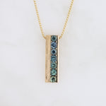 Load image into Gallery viewer, Seven Montana Sapphire Bar Pendant in Yellow Gold