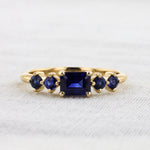 Load image into Gallery viewer, East-West Emerald-Cut Sapphire Ring in Yellow Gold
