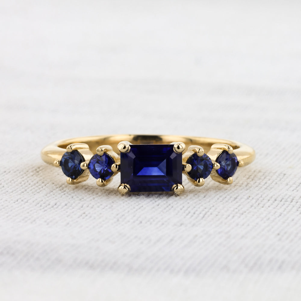 East-West Emerald-Cut Sapphire Ring in Yellow Gold