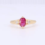 Load image into Gallery viewer, Gold ring featuring an oval ruby and two sparkling diamonds, perfect for elegant occasions.