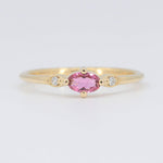 Load image into Gallery viewer, Gold ring featuring an oval pink tourmaline and diamond accents, showcasing a delicate and elegant style.
