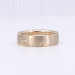 Load image into Gallery viewer, Men's bronze ring with intricate wave pattern, featuring a polished finish and a modern, stylish design.