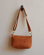 Load image into Gallery viewer, Tan Leather Crossbody Bag with Adjustable Strap and Brass Hardware - Kizer Cummings Jewelers