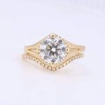Load image into Gallery viewer, Elegant gold engagement ring with a circular diamond center and sparkling side stones, perfect for special occasions.