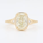 Load image into Gallery viewer, Vintage-inspired yellow gold ring featuring a cushion-cut diamond and side accents. Elegant and timeless design.