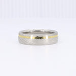 Load image into Gallery viewer, Men's damascus steel ring with gold inlay, brushed silver finish, modern and stylish design.