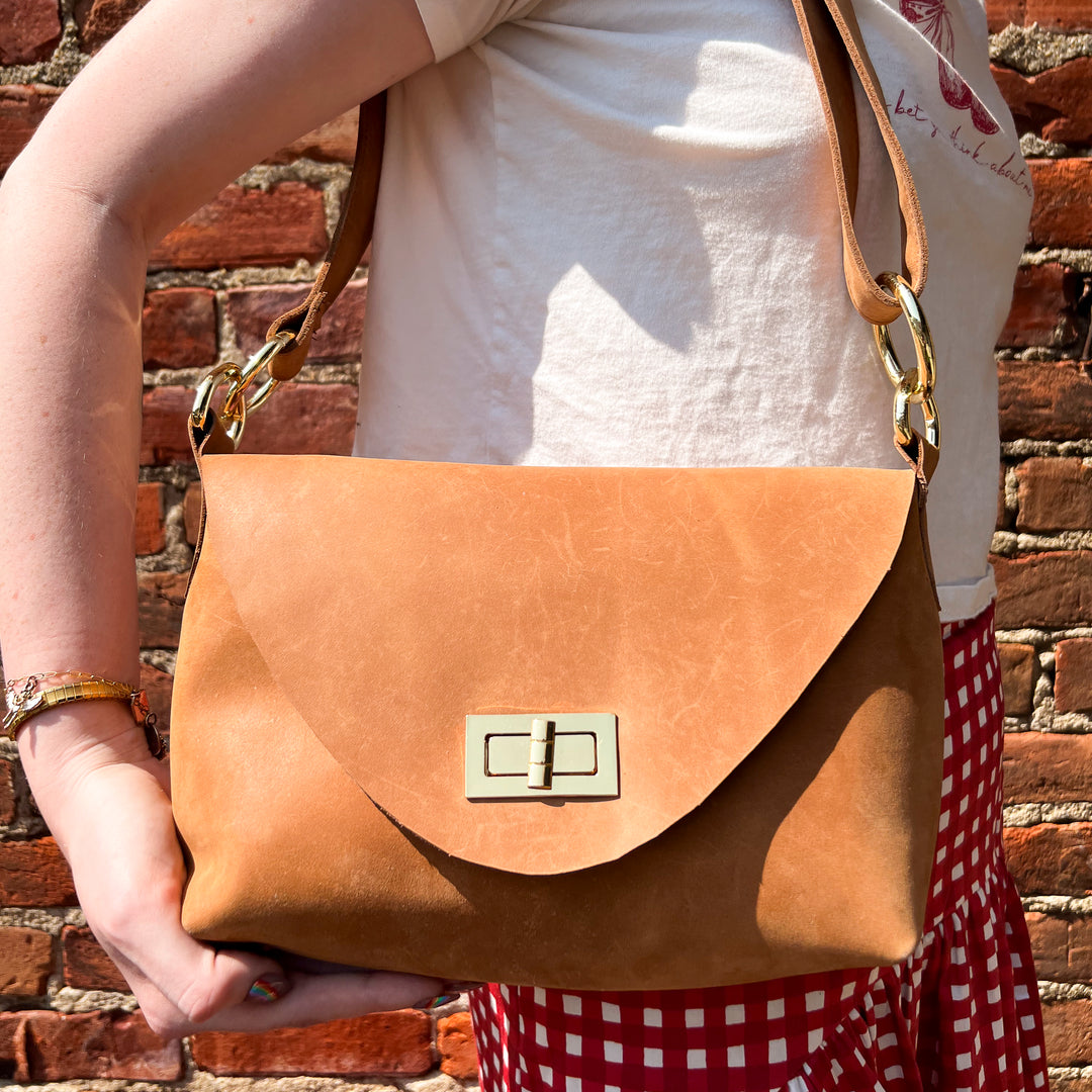 Tan Leather Crossbody Bag with Adjustable Strap and Brass Hardware