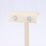 Load image into Gallery viewer, Sterling silver stud earrings featuring round, brilliant-cut clear cubic zirconia stones.