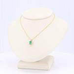 Load image into Gallery viewer, Emerald-Cut Emerald Solitaire Pendant in 14K Yellow Gold