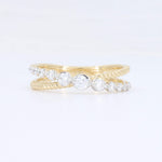 Load image into Gallery viewer, Elegant gold twist ring featuring sparkling clear cubic zirconia stones, perfect for stacking or as an engagement ring.