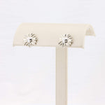 Load image into Gallery viewer, Silver sunburst earrings with a central gemstone, perfect for a trendy, sophisticated look.
