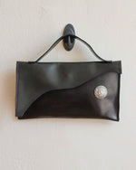 Load image into Gallery viewer, Glossy Black Leather Asymmetrical Clutch Bag with White Metal Hardware - Kizer Cummings Jewelers