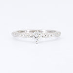 Load image into Gallery viewer, Sterling silver engagement ring with intricate band detailing and a sparkling round diamond center stone.